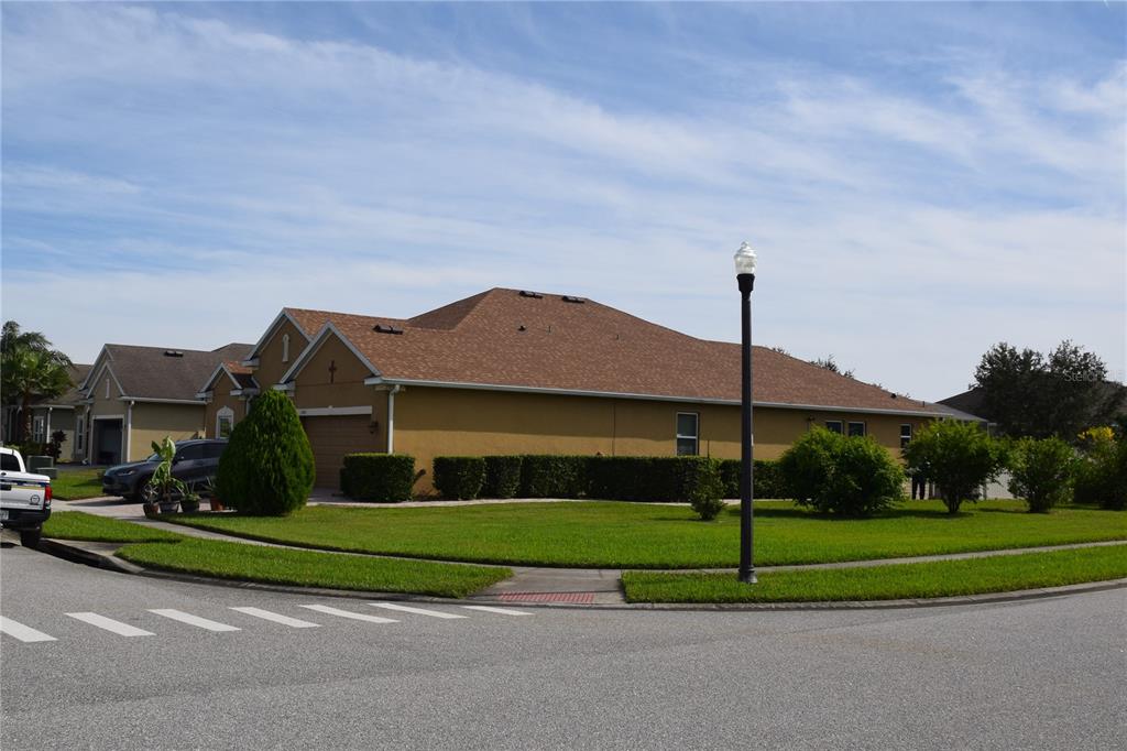 3500 Sprite Lane St. Cloud, FL 34772 - Photo 4 of 52 a view of houses with a garden and entertaining space