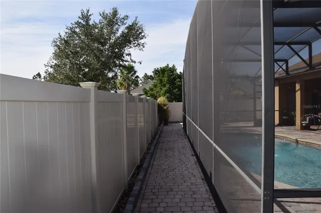 a view of a chairs and table in patio