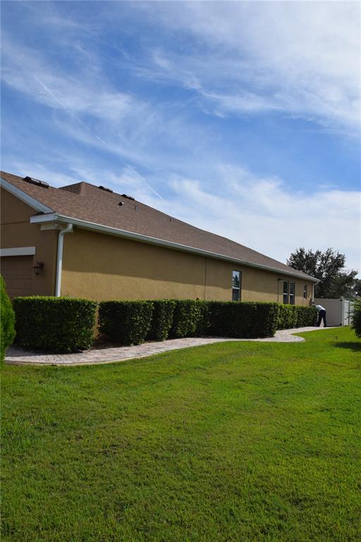3500 Sprite Lane St. Cloud, FL 34772 - Photo 42 of 52 a front view of a house with a yard
