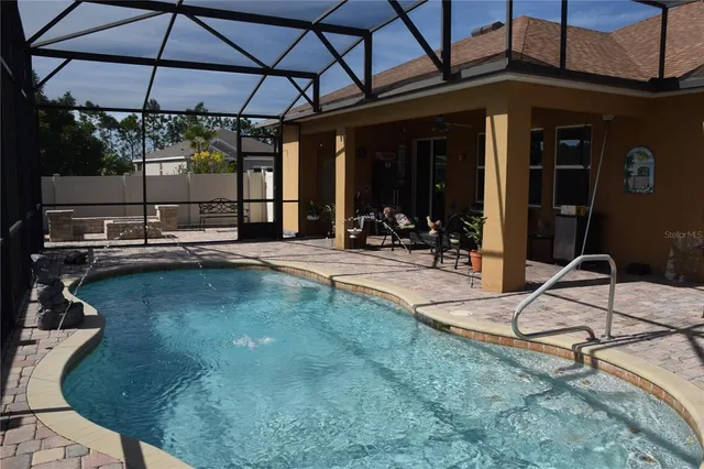 a view of a porch with a table and chairs