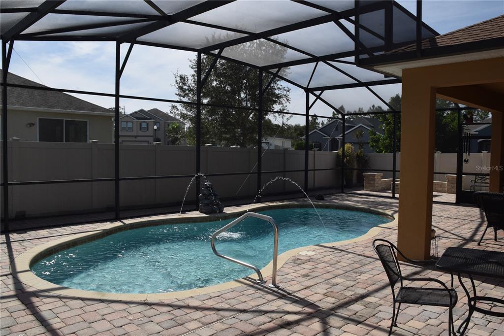3500 Sprite Lane St. Cloud, FL 34772 - Photo 45 of 52 a view of a swimming pool with a patio and a backyard