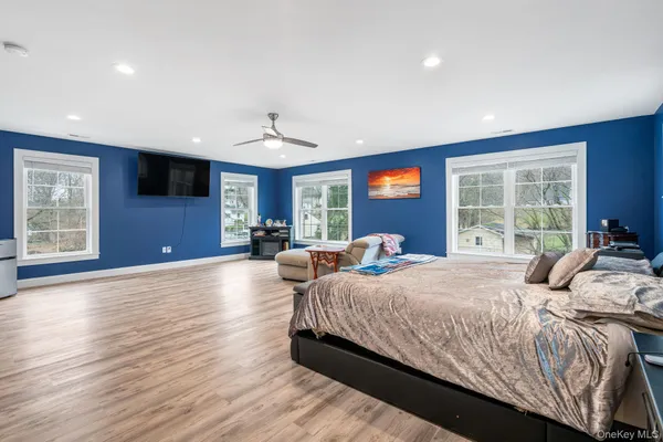 a bedroom with a large bed and a window
