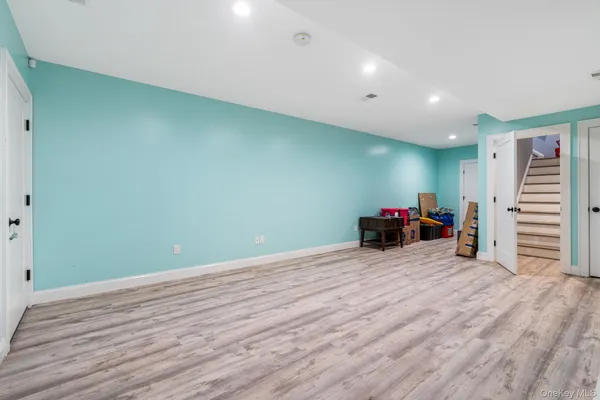 a view of a room with wooden floor and closet