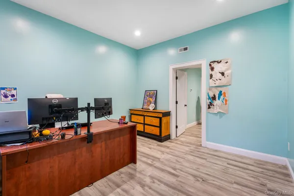 a workspace with furniture and wooden floor