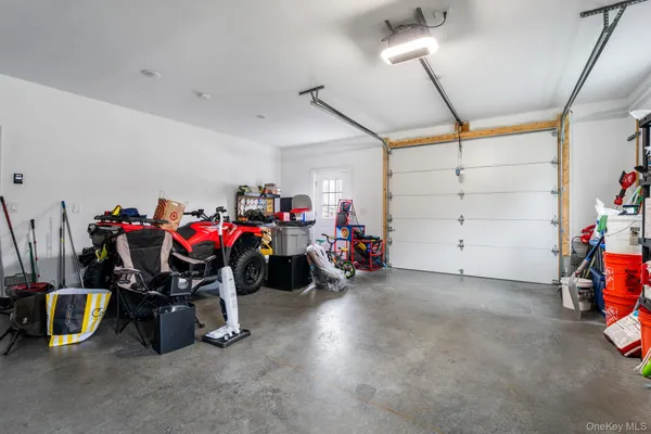 a view of a garage with a bike and white walls