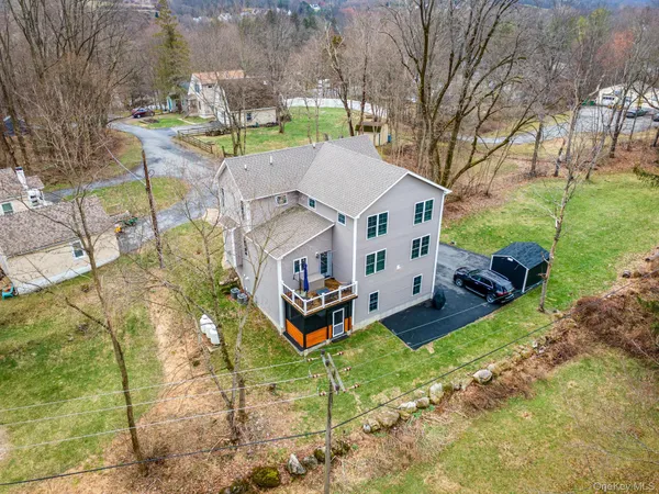 a aerial view of a house with swimming pool and garden