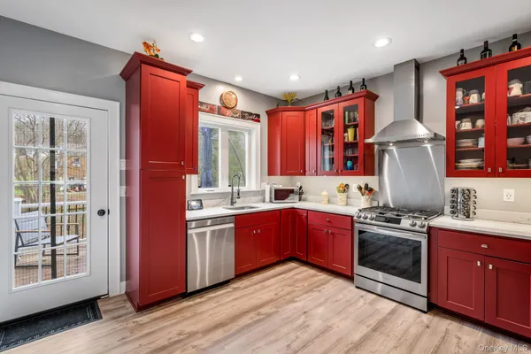 a kitchen with stainless steel appliances granite countertop a stove and a refrigerator