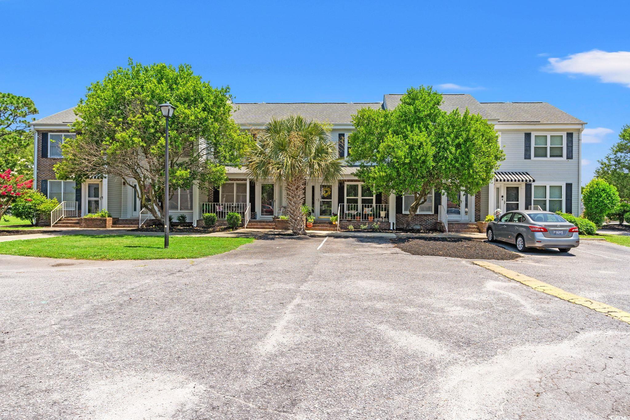 4115 Little River Road, Unit 10E Myrtle Beach, SC 29577 - Photo 1 of 23 Multi unit property featuring uncovered parking and covered porch
