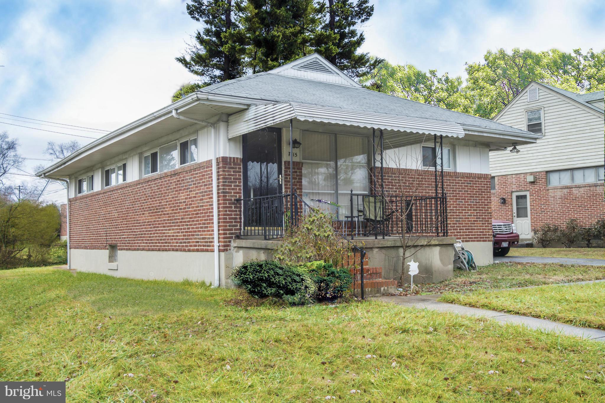 7415 Sudbrook Road Baltimore, MD 21208 - Photo 1 of 13 a front view of a house with a garden and plants