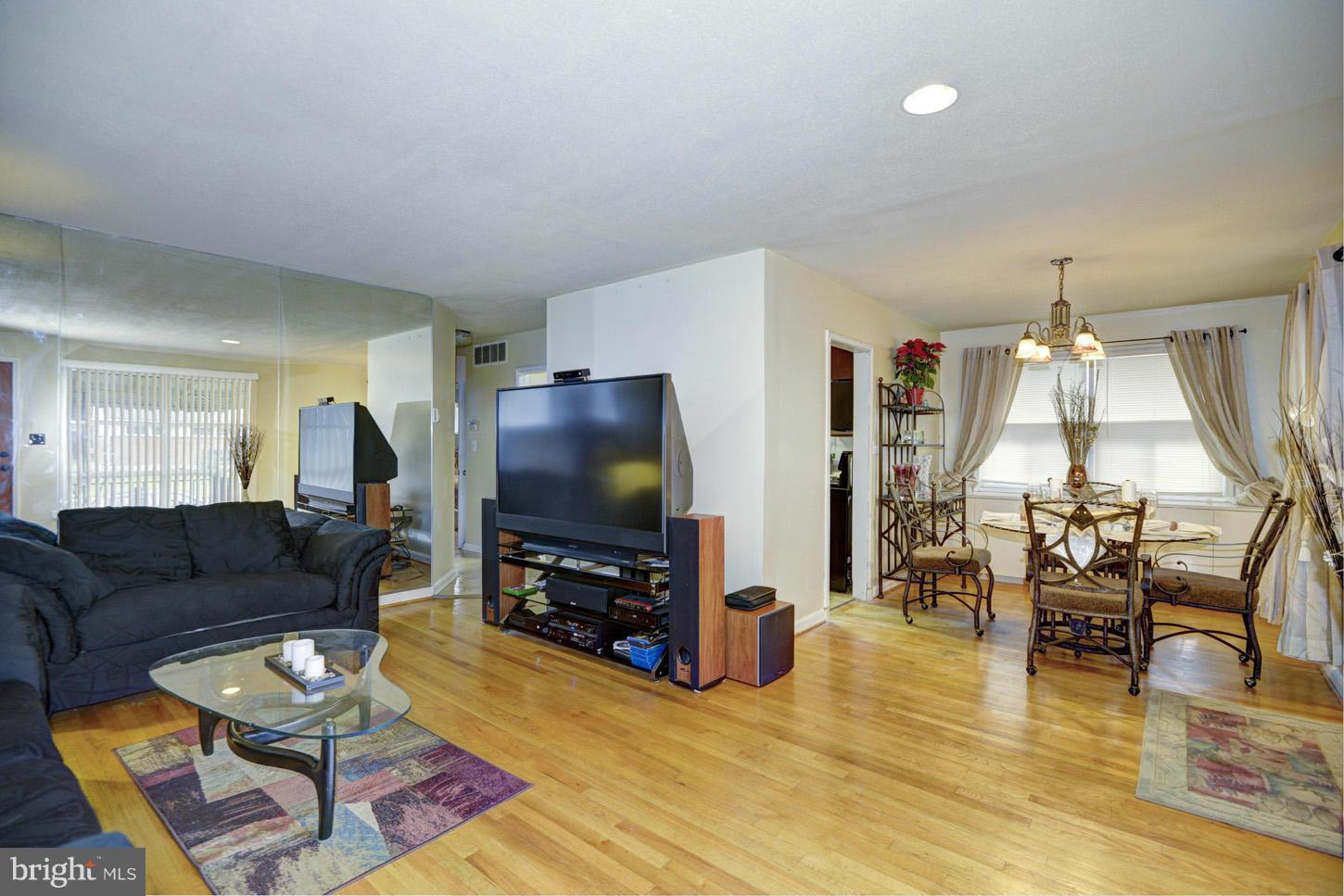 7415 Sudbrook Road Baltimore, MD 21208 - Photo 2 of 13 a living room with furniture and a flat screen tv