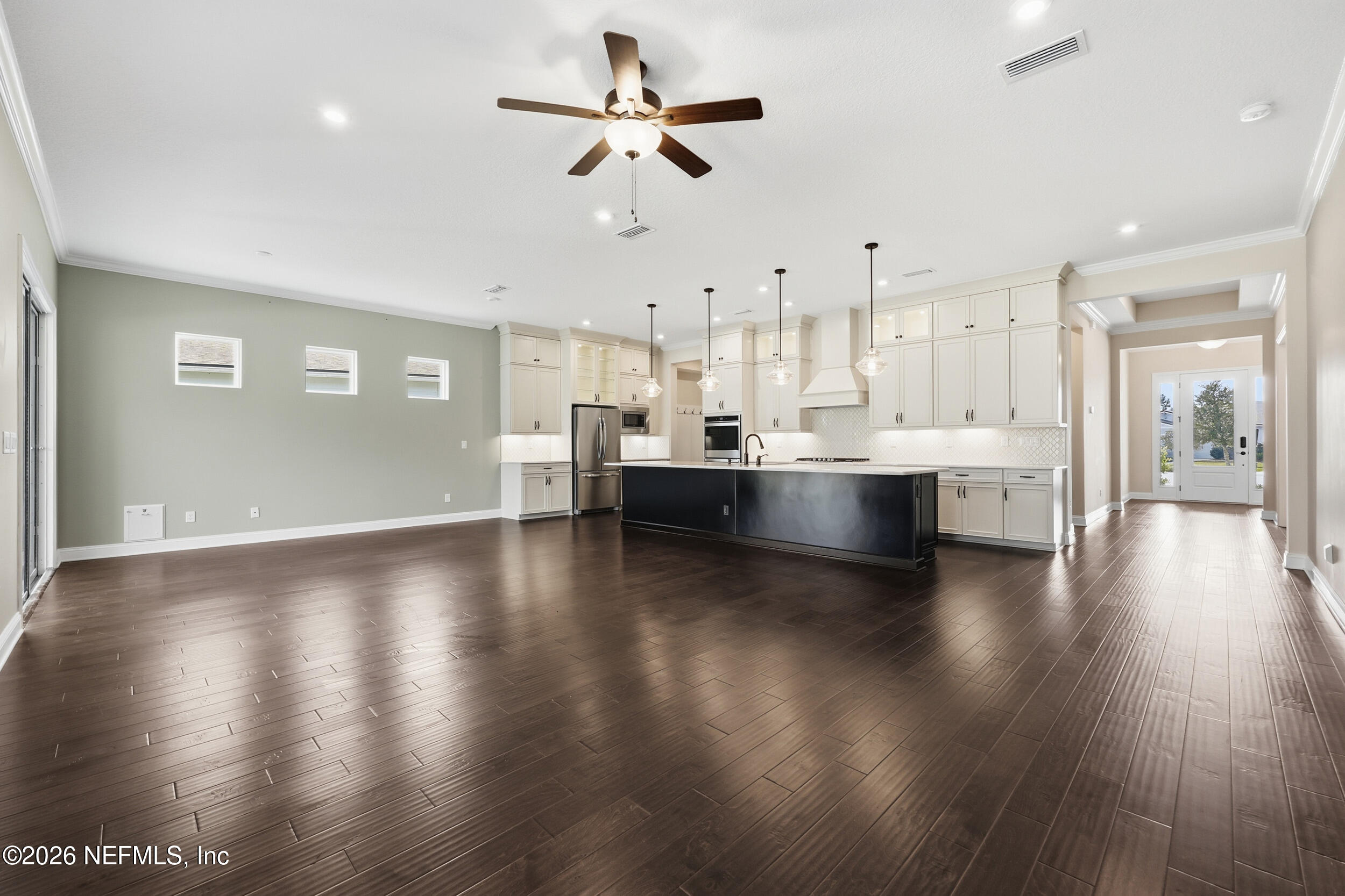 130 Key Grass Court St. Johns, FL 32259 - Photo 11 of 95 a view of kitchen and hall with wooden floor