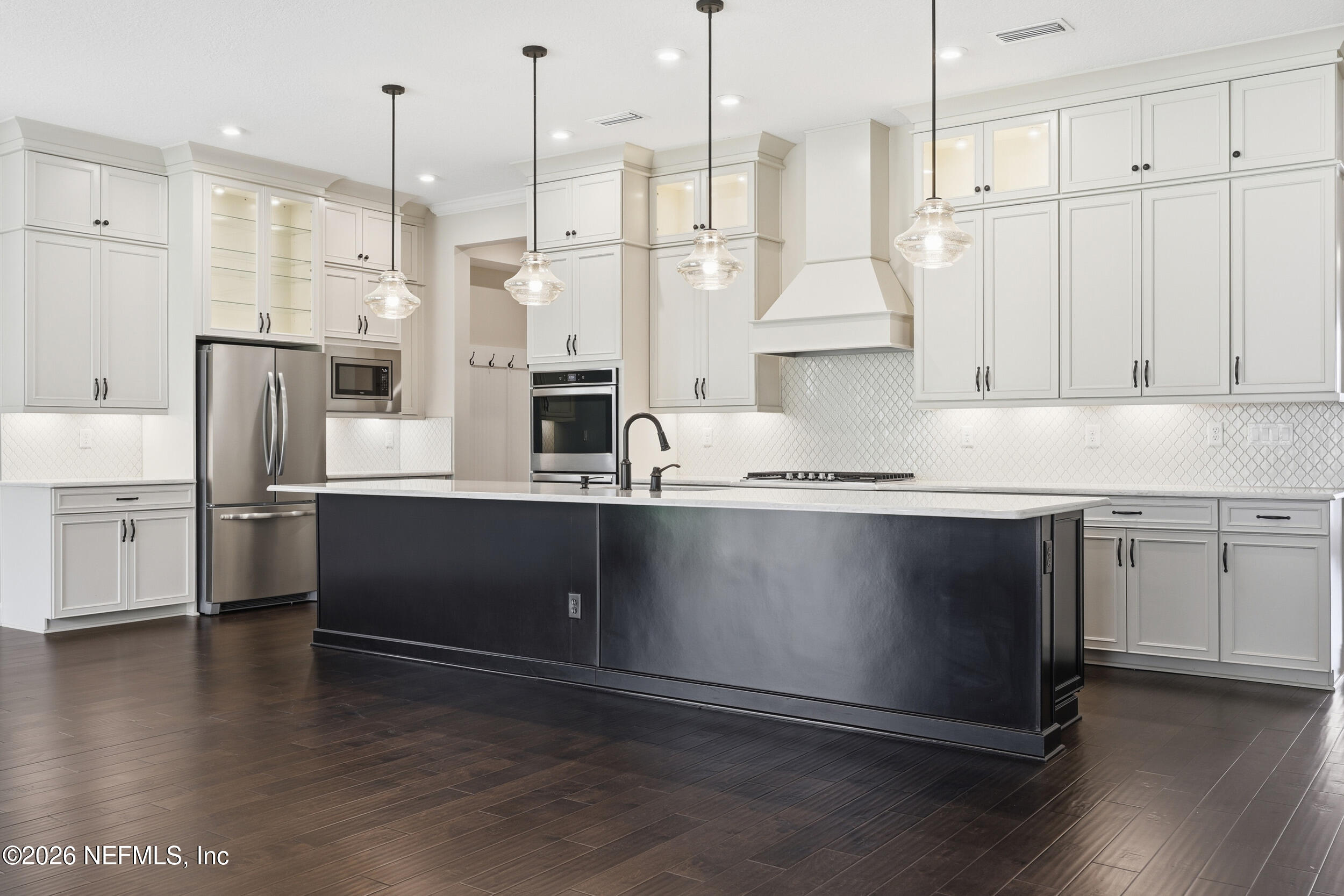 130 Key Grass Court St. Johns, FL 32259 - Photo 12 of 95 a kitchen with stainless steel appliances granite countertop a refrigerator a sink and a stove