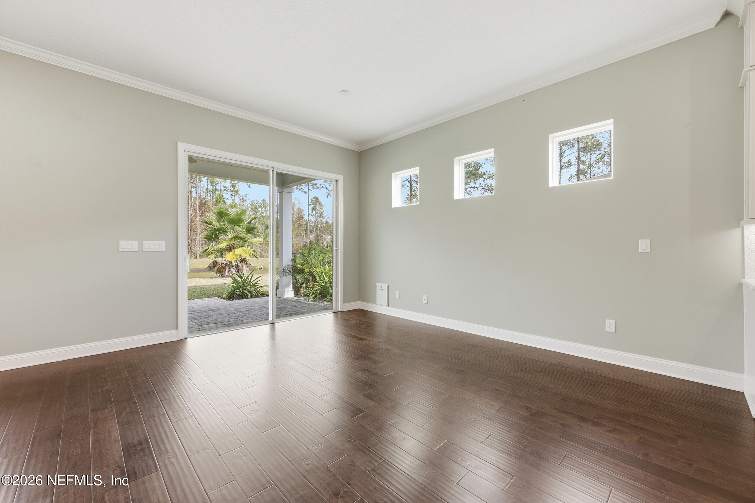 130 Key Grass Court St. Johns, FL 32259 - Photo 19 of 95 a view of an empty room with wooden floor and a window