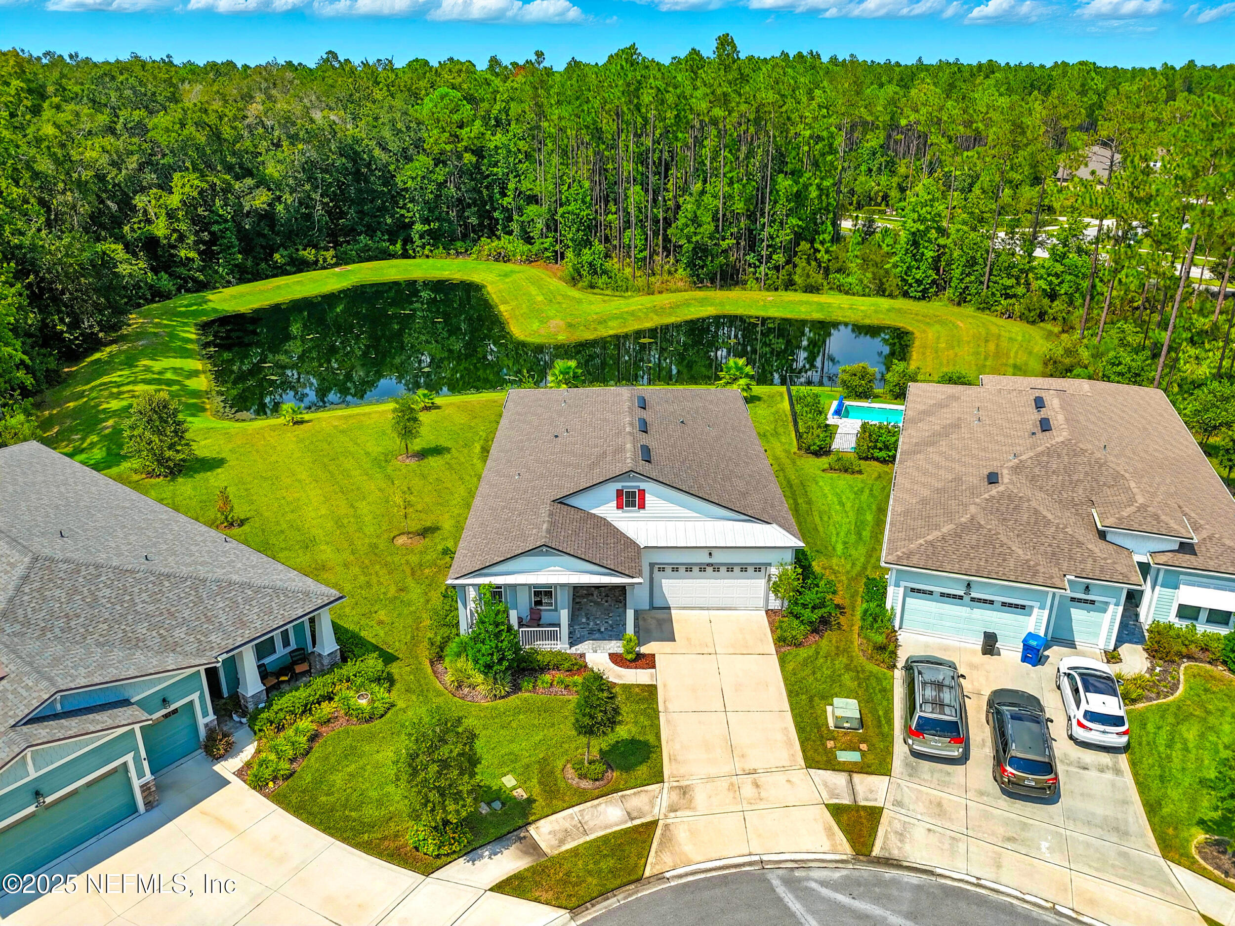 130 Key Grass Court St. Johns, FL 32259 - Photo 2 of 95 Lot line at left corner of pond