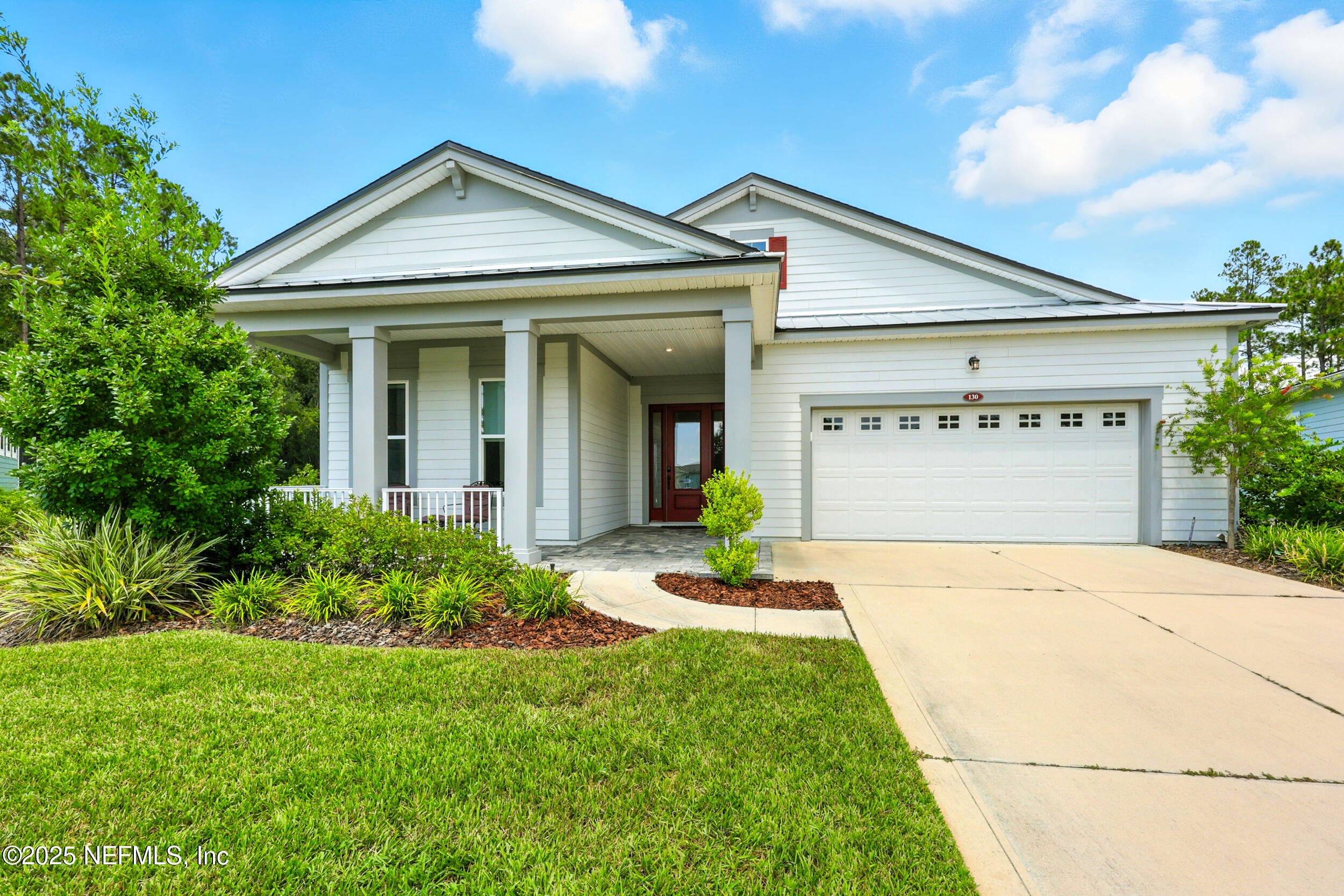 130 Key Grass Court St. Johns, FL 32259 - Photo 3 of 95 a front view of a house with a yard and garage