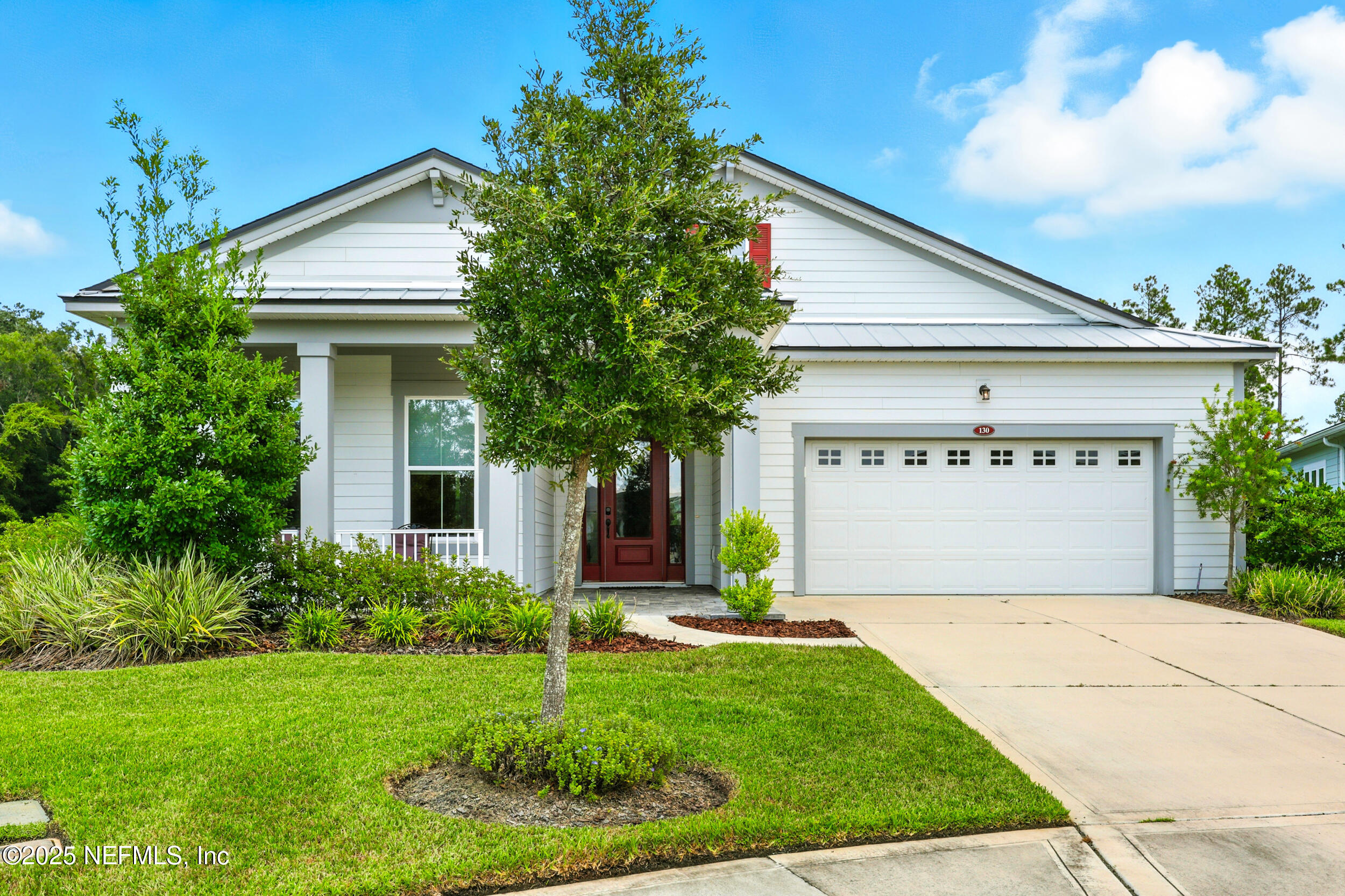 130 Key Grass Court St. Johns, FL 32259 - Photo 4 of 95 a front view of house with garage and yard