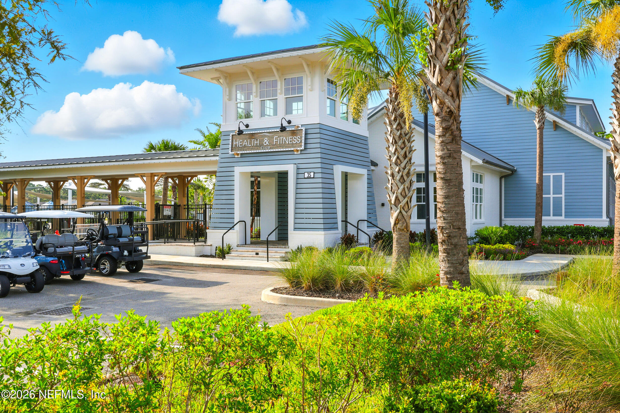 130 Key Grass Court St. Johns, FL 32259 - Photo 79 of 95 a front view of a house with swimming pool outdoor seating and covered with green space