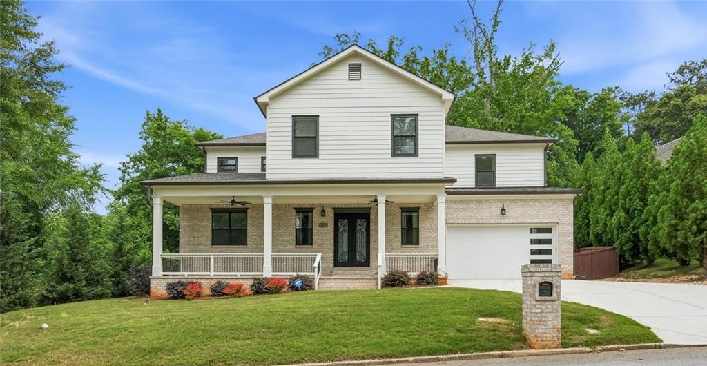 2415 West Rugby Avenue Atlanta, GA 30337 - Photo 1 of 40 a front view of a house with a yard