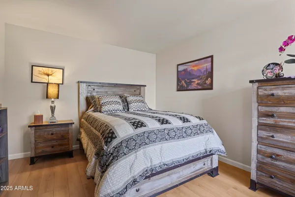 a bedroom with a bed and a view of bedroom
