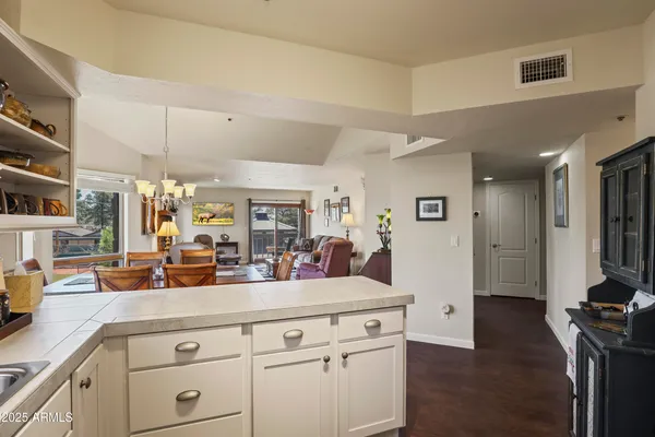 a view of living room with furniture and flat screen tv