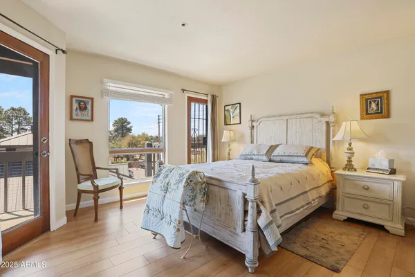 a bedroom with a bed and a tv on table