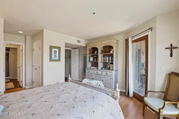a bedroom with furniture and a window