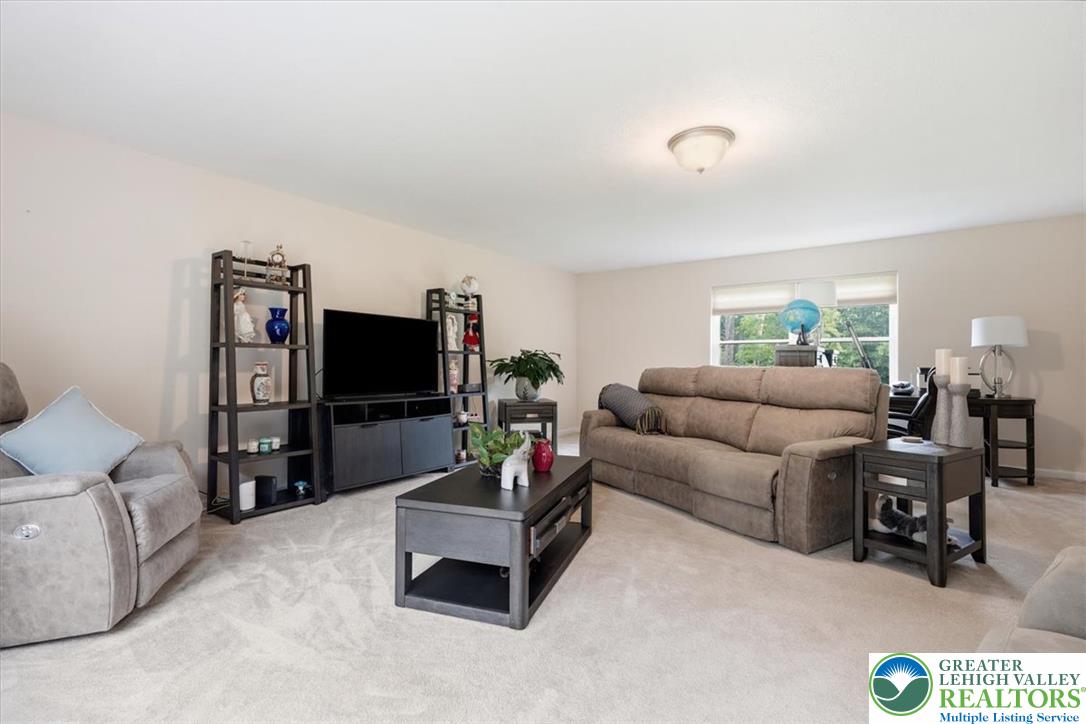 5032 Custard Road Stroudsburg, PA 18360 - Photo 52 of 80 Plush wall-to-wall carpeting and wide windows define this comfortable living area.