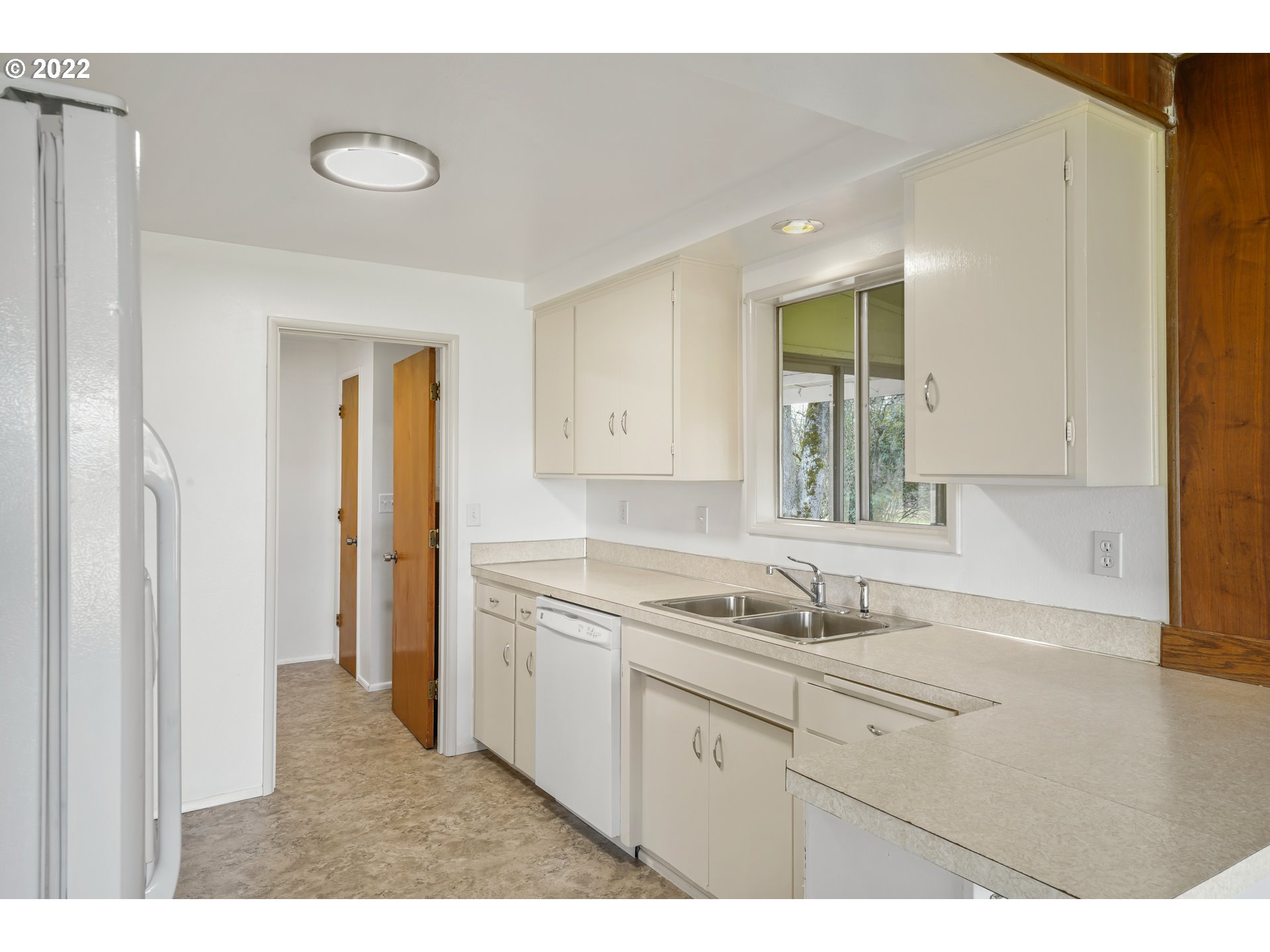 84926 Cloverdale Road Creswell, OR 97426 - Photo 11 of 31 a kitchen with a sink cabinets and appliances
