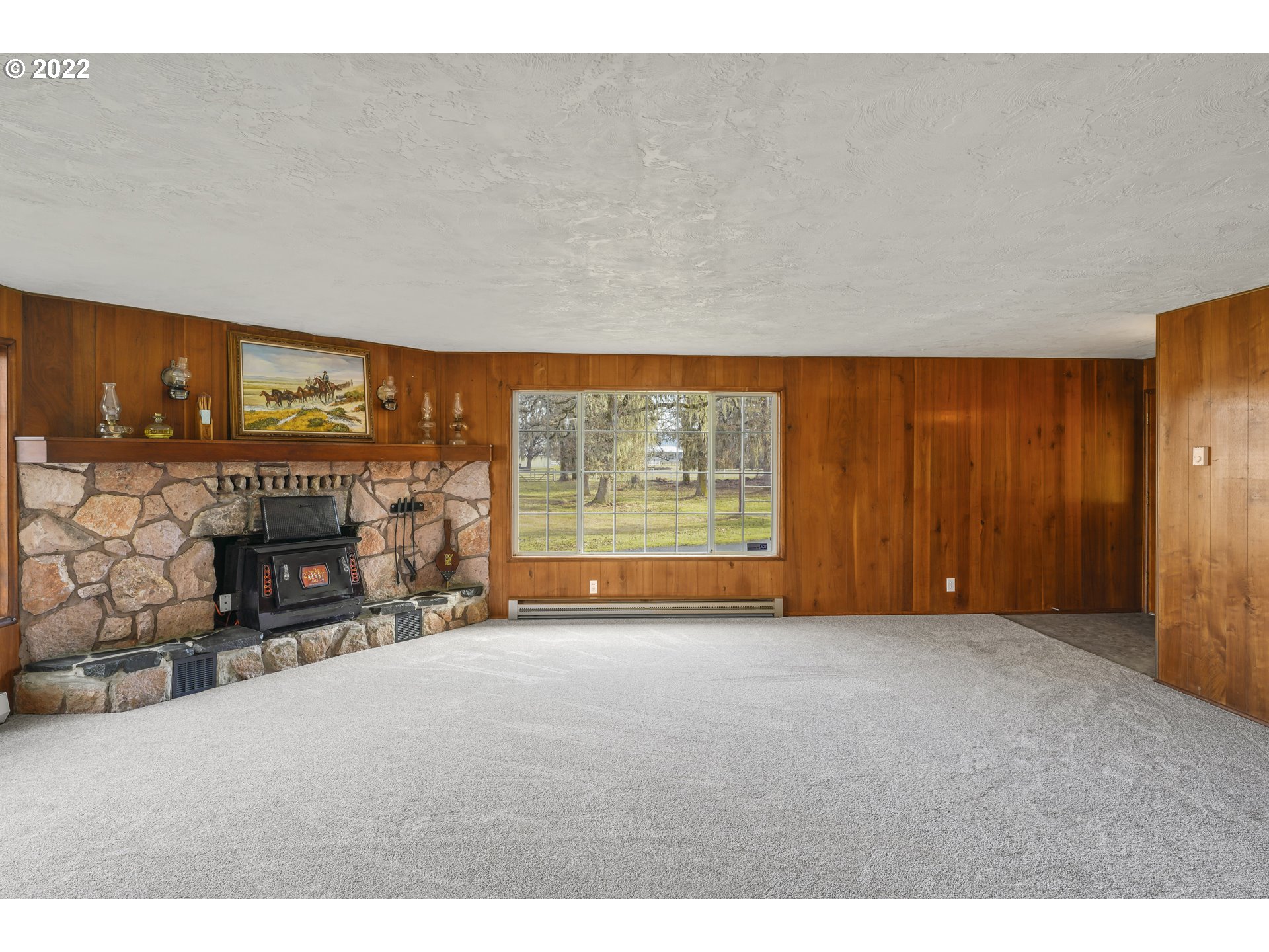84926 Cloverdale Road Creswell, OR 97426 - Photo 8 of 31 a view of an empty room with a fireplace