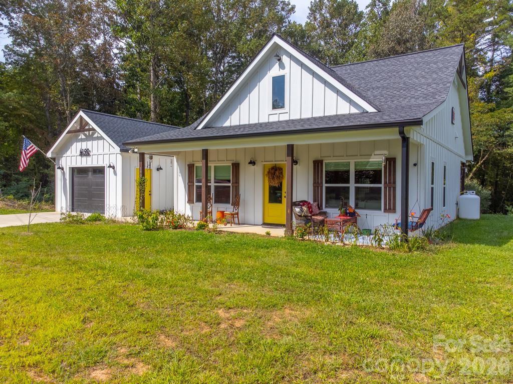 190 Fort Hembree Road Hayesville, NC 28904 - Photo 1 of 18 a view of a house with a garden and porch
