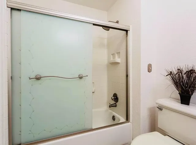 a bedroom with a bed and a walk in closet