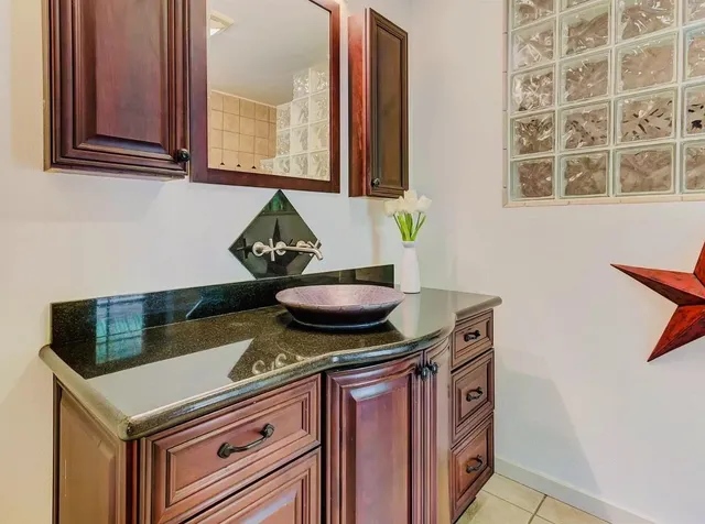 a white toilet sitting next to a bathroom sink