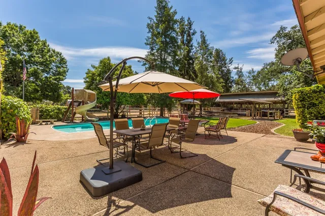 a view of a swimming pool with a bench