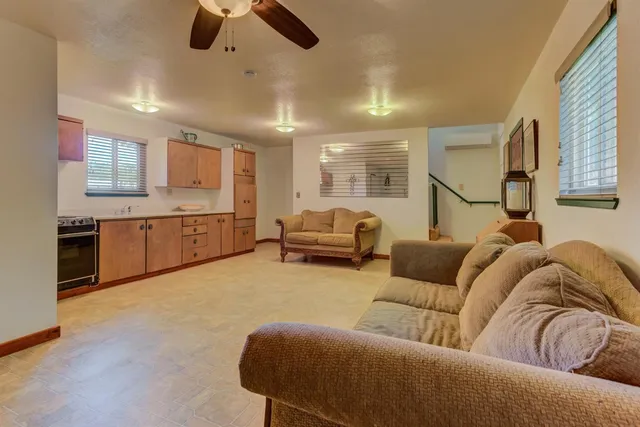 a view of kitchen with furniture and a refrigerator