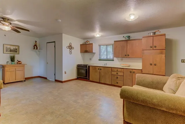 a bed room with a bed and a chair