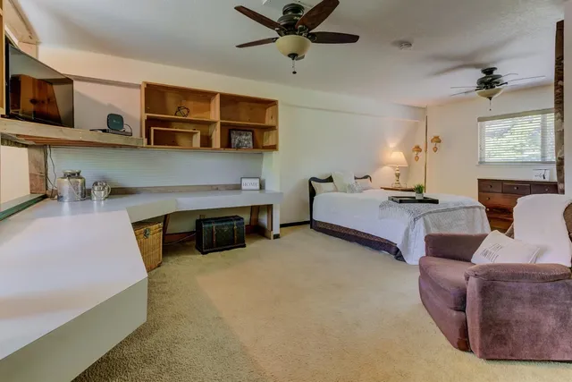 an outdoor space with swimming pool and furniture