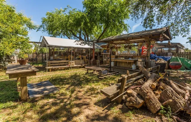 a yard with swimming pool and green space