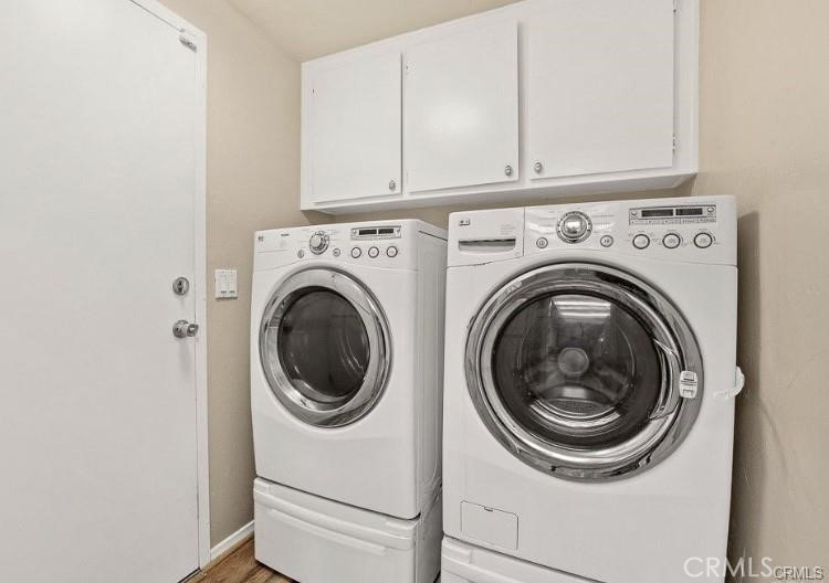 801 Yankee Point Way Oceanside, CA 92058 - Photo 7 of 14 Laundry room with storage cabinets above