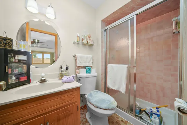 a bathroom with a sink toilet and shower
