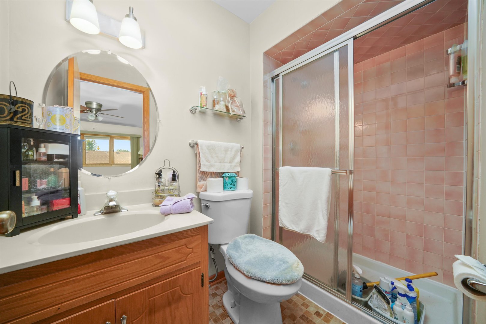 17921 Alaska Court, Unit 8 Orland Park, IL 60467 - Photo 12 of 36 a bathroom with a sink toilet and shower