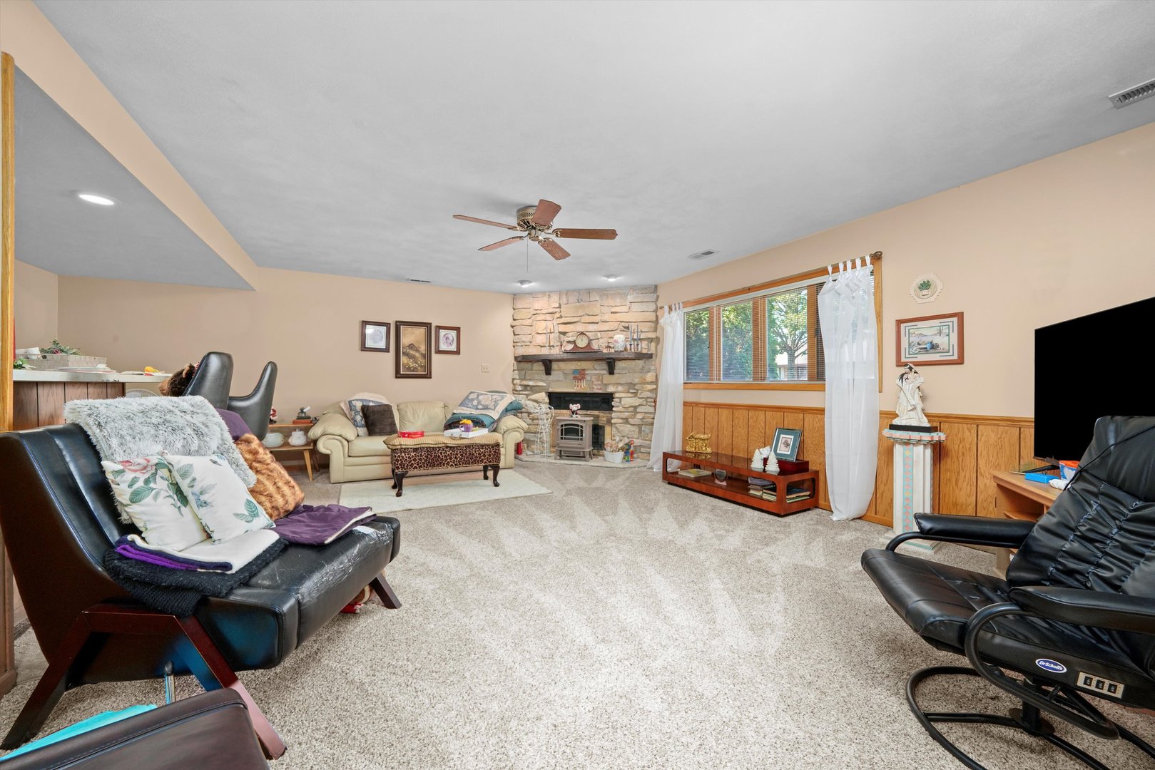 17921 Alaska Court, Unit 8 Orland Park, IL 60467 - Photo 19 of 36 a living room with furniture a flat screen tv and a large window