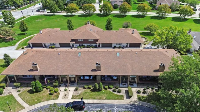 an aerial view of a house with a garden