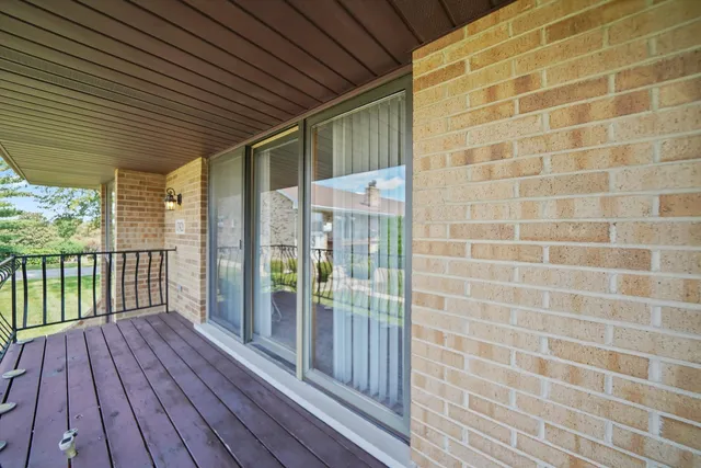 a view of a balcony with wooden floor