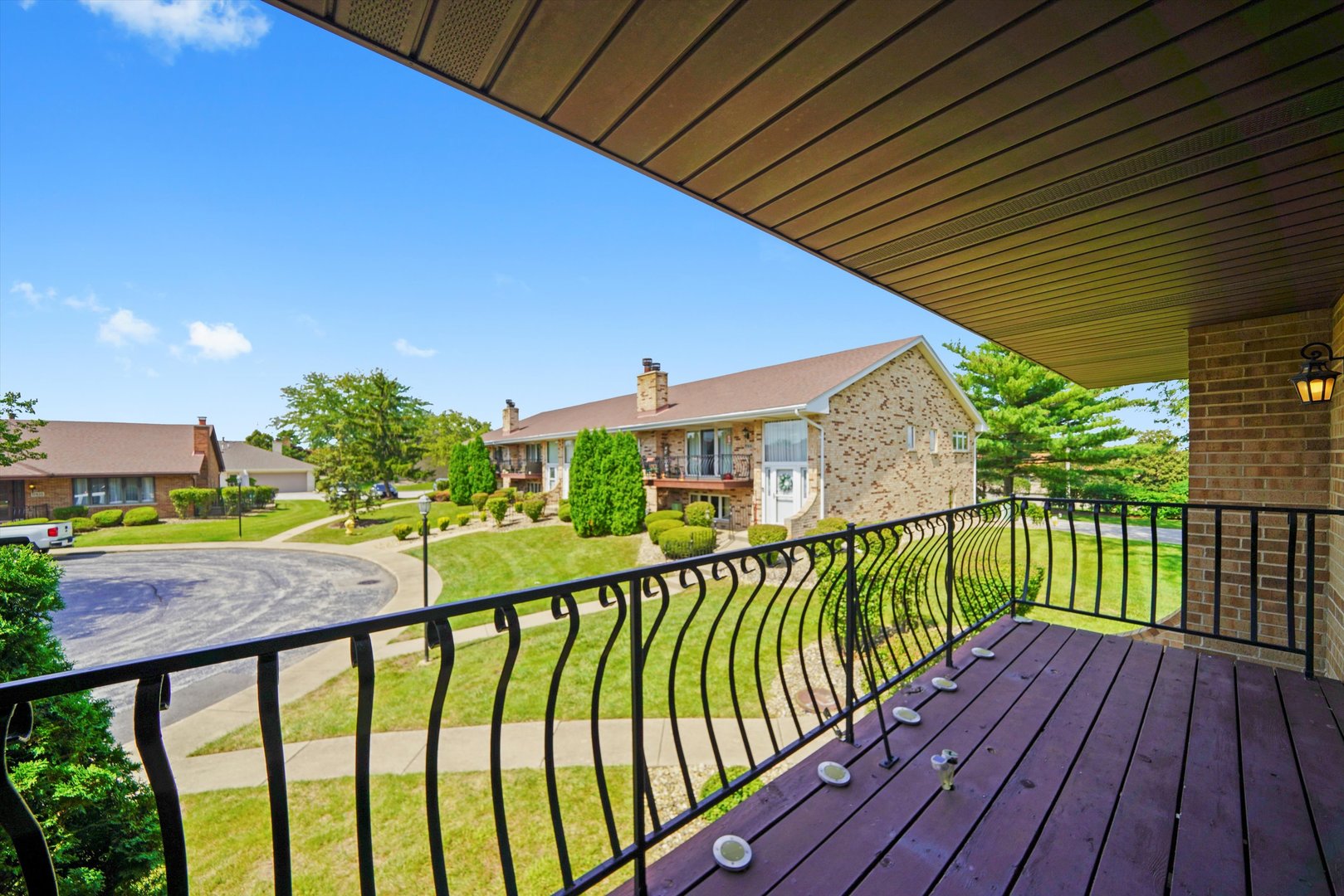 17921 Alaska Court, Unit 8 Orland Park, IL 60467 - Photo 29 of 36 a view of a balcony with wooden floor
