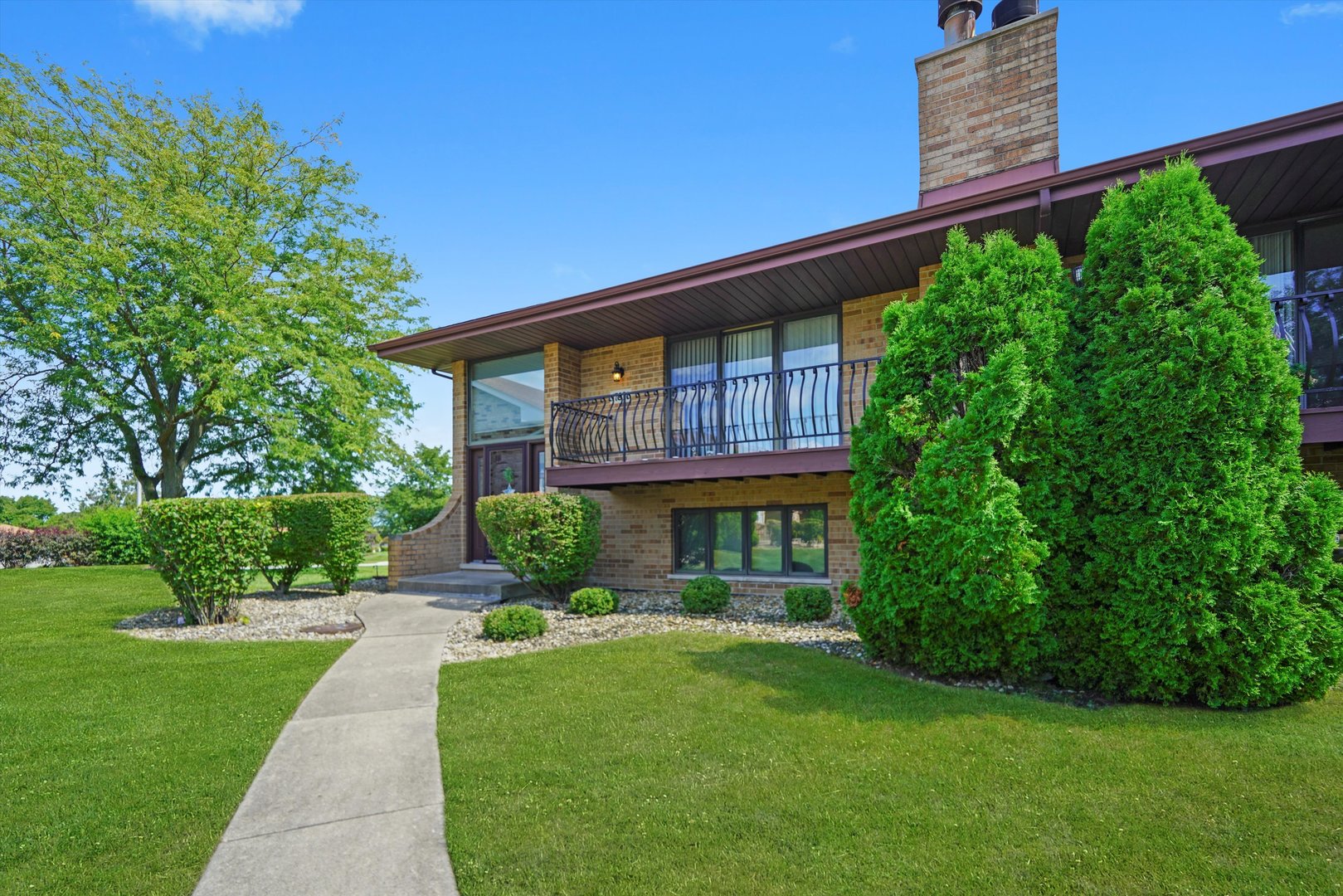 17921 Alaska Court, Unit 8 Orland Park, IL 60467 - Photo 35 of 36 a front view of a house with a yard