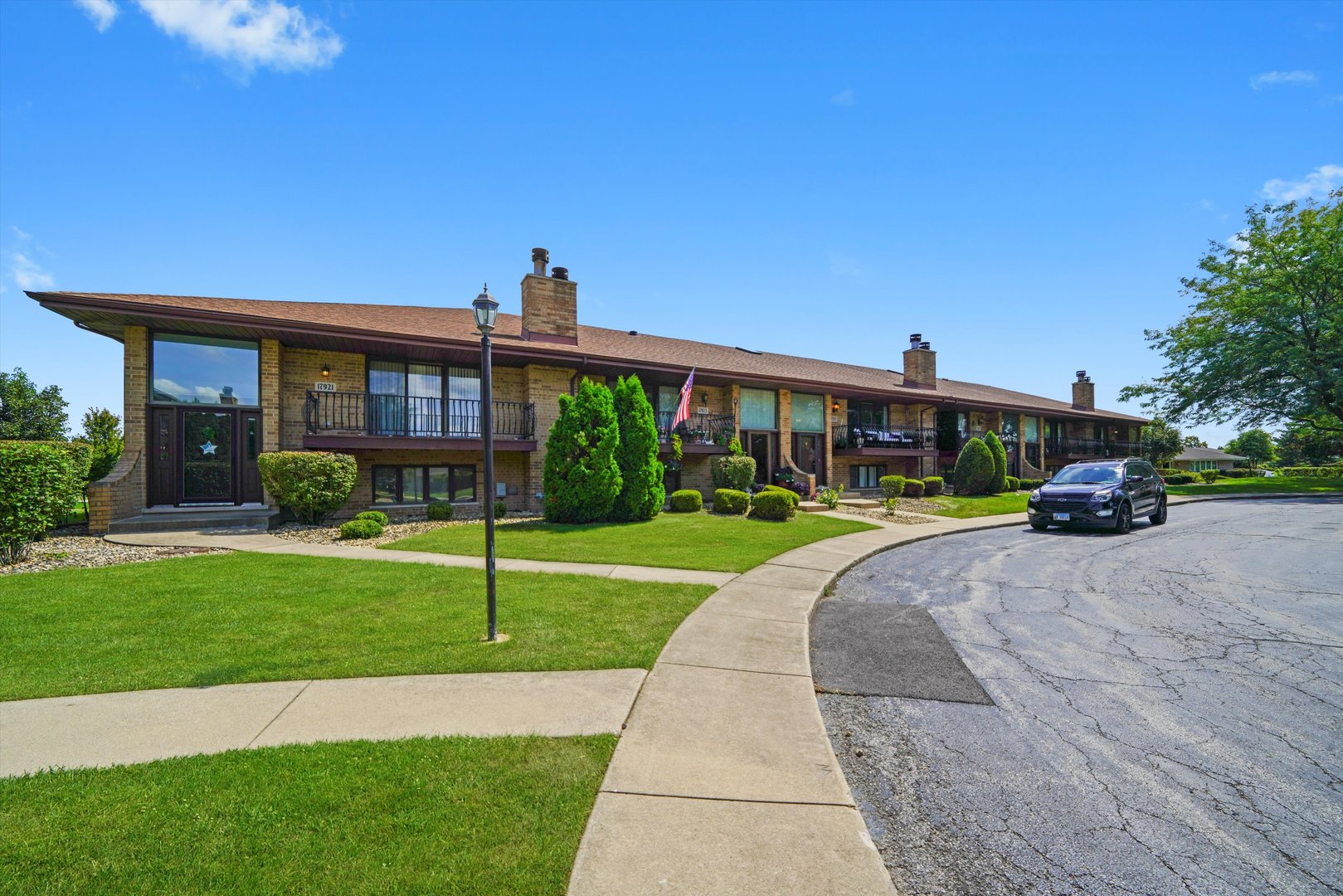 17921 Alaska Court, Unit 8 Orland Park, IL 60467 - Photo 36 of 36 a front view of a house with a yard