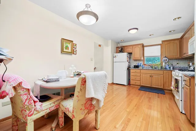 a kitchen with a sink appliances and cabinets