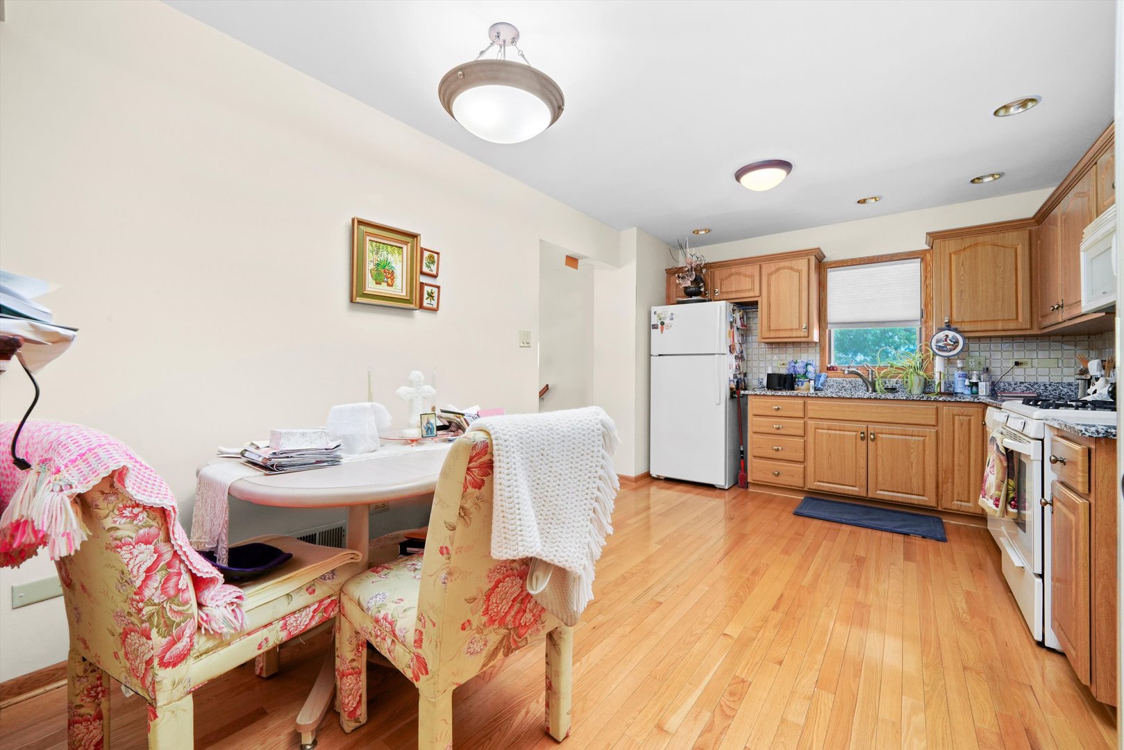 17921 Alaska Court, Unit 8 Orland Park, IL 60467 - Photo 6 of 36 a kitchen with a sink appliances and cabinets