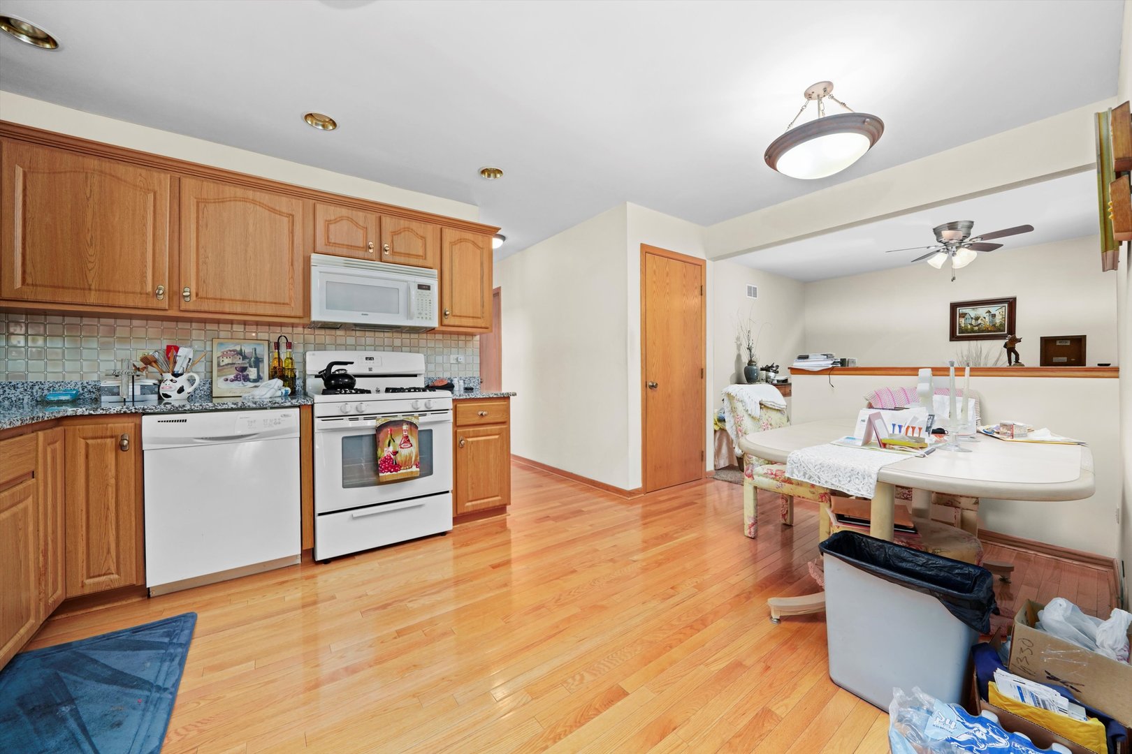 17921 Alaska Court, Unit 8 Orland Park, IL 60467 - Photo 7 of 36 a kitchen with a sink cabinets and wooden floor