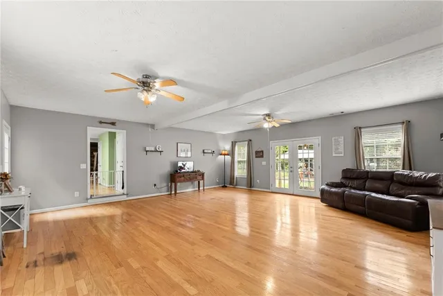 a bathroom with a toilet a sink and a mirror
